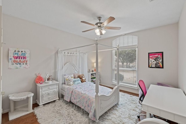 bedroom featuring wood-type flooring and ceiling fan