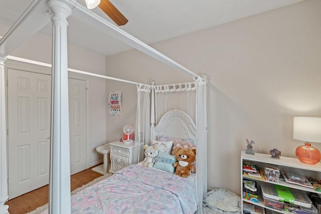 bedroom with light hardwood / wood-style floors and ceiling fan