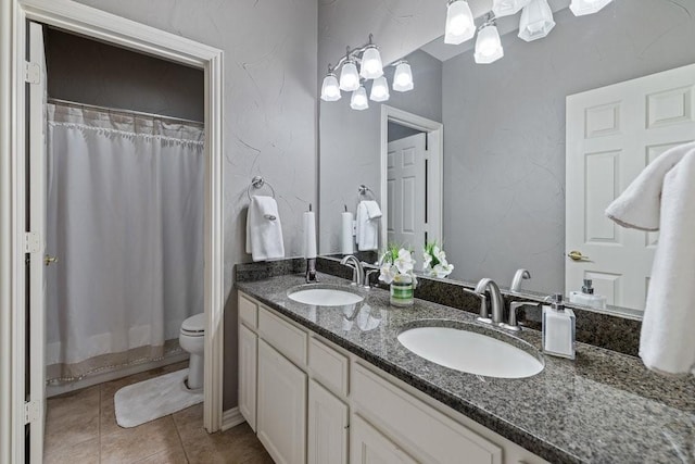 bathroom featuring tile patterned flooring, vanity, a shower with shower curtain, and toilet