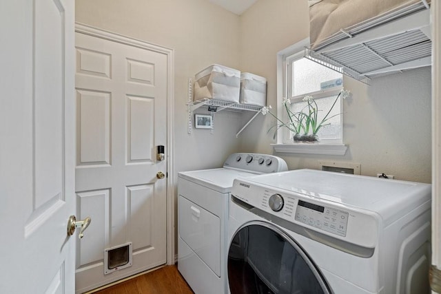 laundry room featuring independent washer and dryer and dark hardwood / wood-style floors