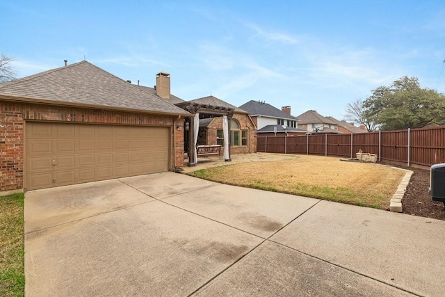 view of front of house with a garage and a front yard