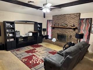 living room featuring ceiling fan and a brick fireplace