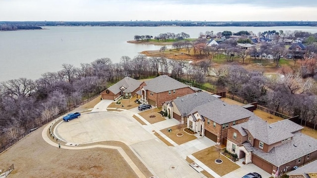 bird's eye view featuring a residential view and a water view