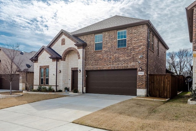 view of front facade with a garage and a front lawn