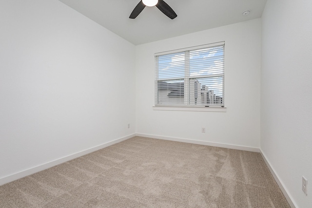 unfurnished room featuring carpet floors and ceiling fan