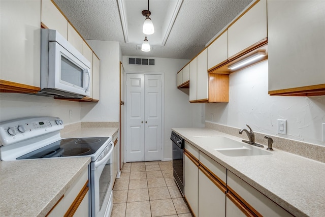 kitchen with hanging light fixtures, white cabinetry, sink, and white appliances