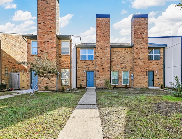 exterior space with a front lawn