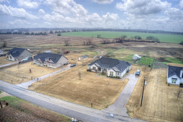 birds eye view of property with a rural view