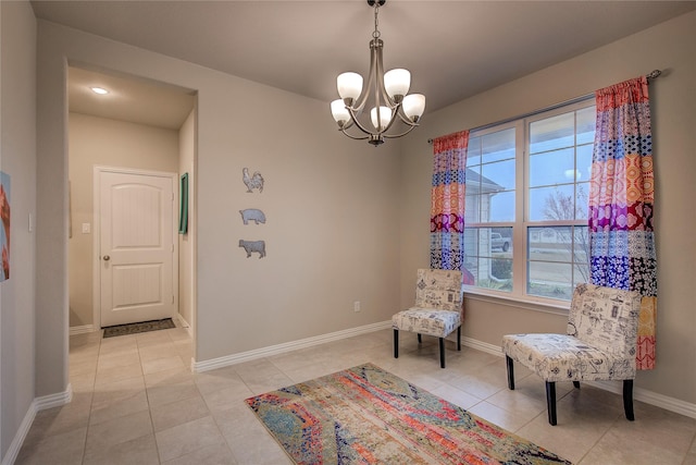 living area with an inviting chandelier and light tile patterned floors