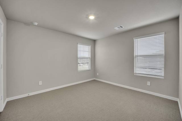 empty room featuring carpet flooring