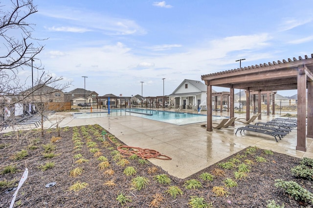 view of pool with a pergola and a patio area