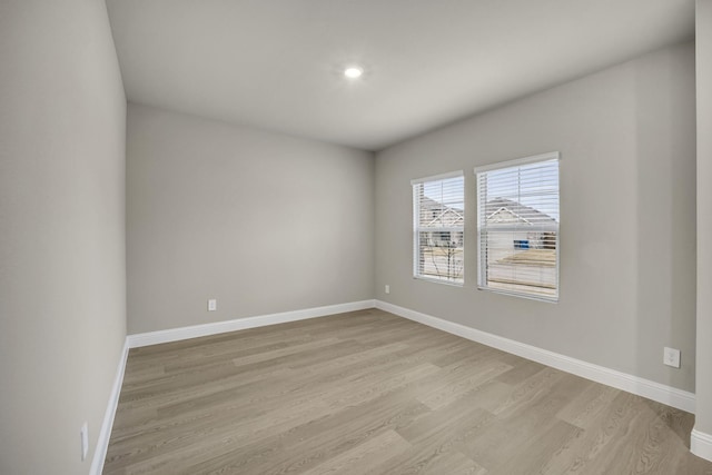 unfurnished room featuring light wood-type flooring