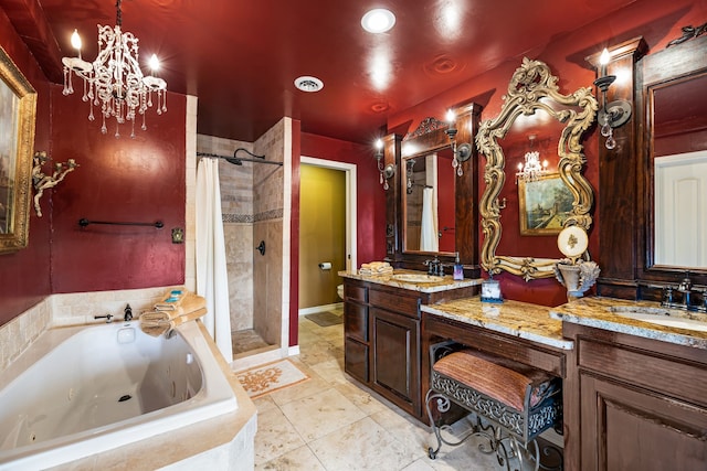 bathroom with independent shower and bath, vanity, and a notable chandelier