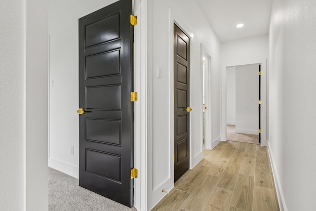 corridor featuring light hardwood / wood-style flooring