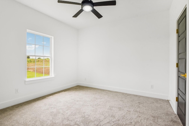 unfurnished room with light carpet and ceiling fan