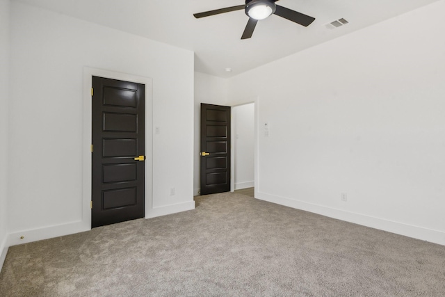 unfurnished bedroom with light colored carpet and ceiling fan