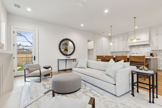 living room with light hardwood / wood-style flooring