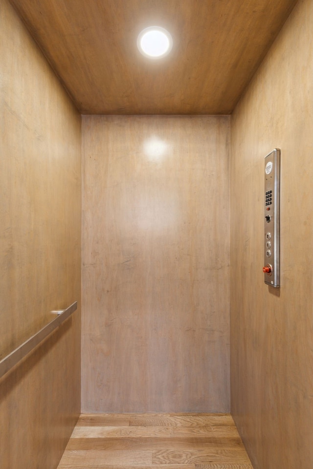 interior details with wooden ceiling and elevator