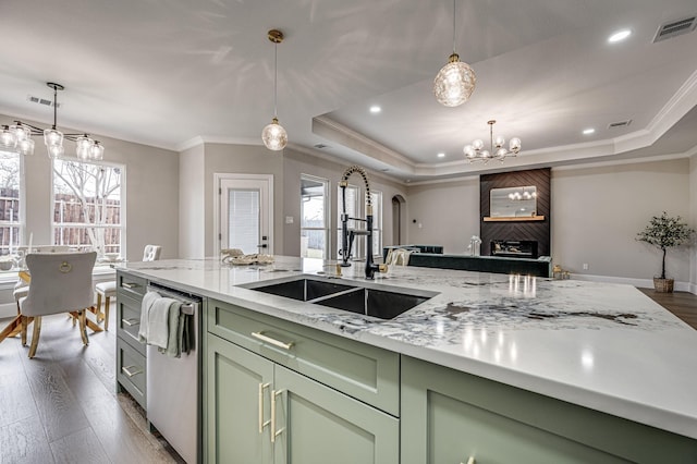 kitchen featuring a notable chandelier, visible vents, a raised ceiling, and light stone counters