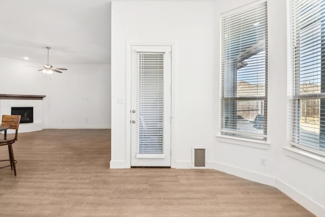 interior space featuring light hardwood / wood-style floors and ceiling fan