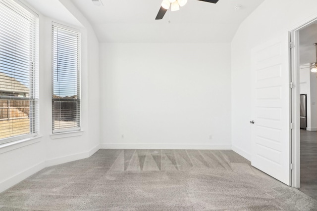 unfurnished room featuring ceiling fan and carpet flooring