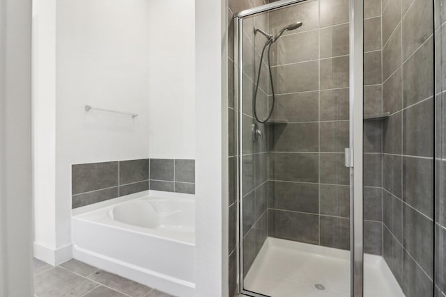 bathroom featuring plus walk in shower and tile patterned floors