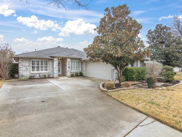 view of front of house with a garage and a front lawn