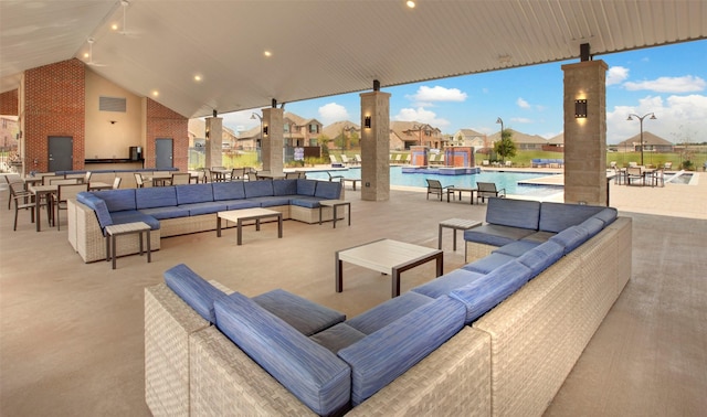 view of patio / terrace featuring an outdoor living space and a community pool