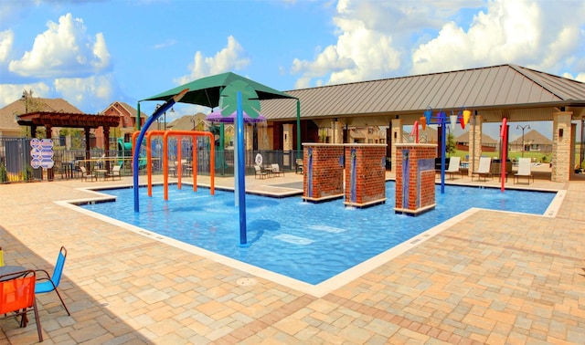 view of swimming pool featuring a playground