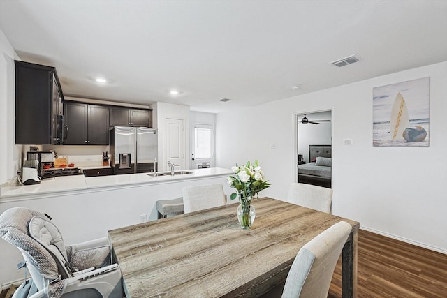 dining space with sink and dark hardwood / wood-style floors