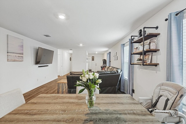 dining room with hardwood / wood-style floors