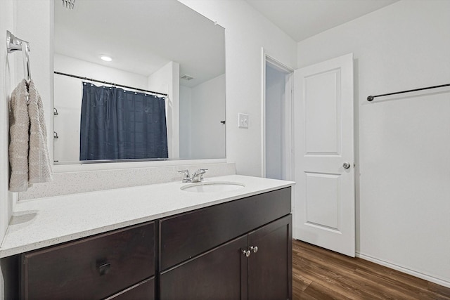 bathroom with vanity and hardwood / wood-style floors