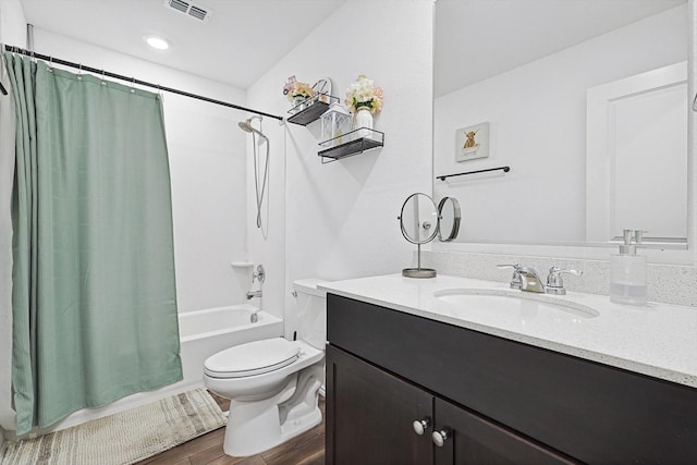 full bathroom with vanity, toilet, and shower / bath combo