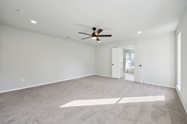 carpeted empty room with ceiling fan