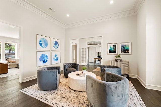 living room with ornamental molding and dark hardwood / wood-style flooring