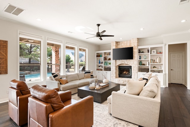 living room with crown molding, a healthy amount of sunlight, and hardwood / wood-style flooring