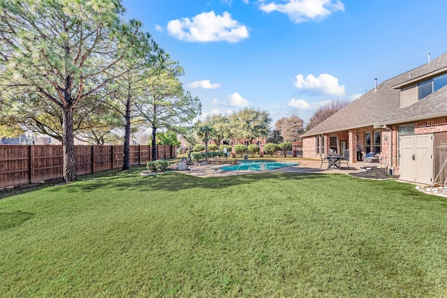 view of yard featuring a fenced in pool and a patio