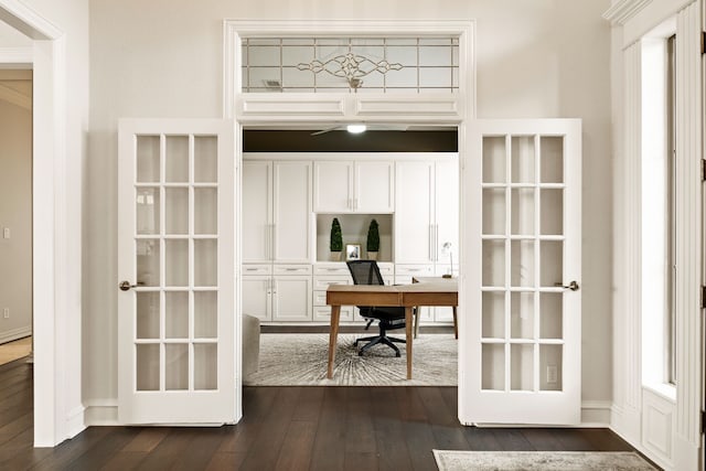 office with dark hardwood / wood-style flooring and french doors