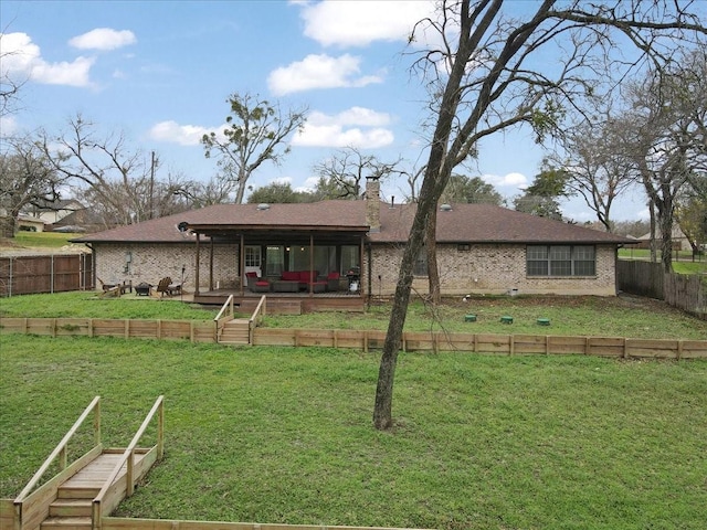 back of house featuring a lawn