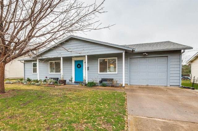 ranch-style home with a garage and a front yard