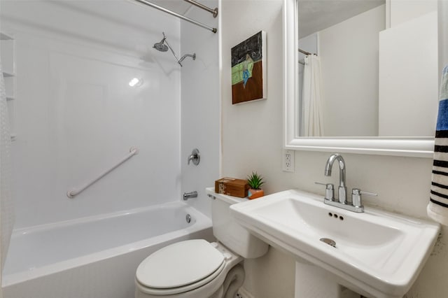 full bathroom featuring sink, shower / tub combo, and toilet