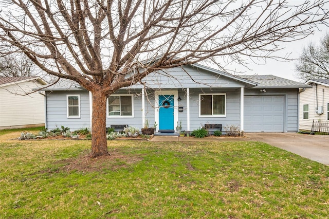 view of front of home with a garage and a front yard