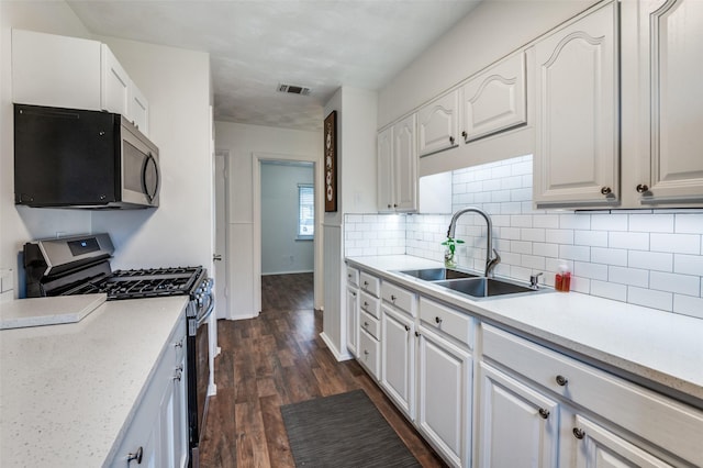 kitchen with white cabinetry, appliances with stainless steel finishes, and sink