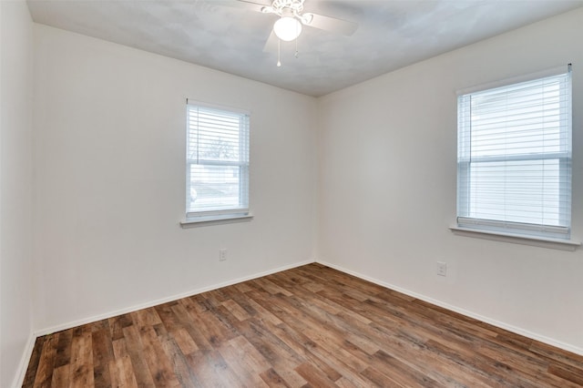 spare room with hardwood / wood-style floors and ceiling fan