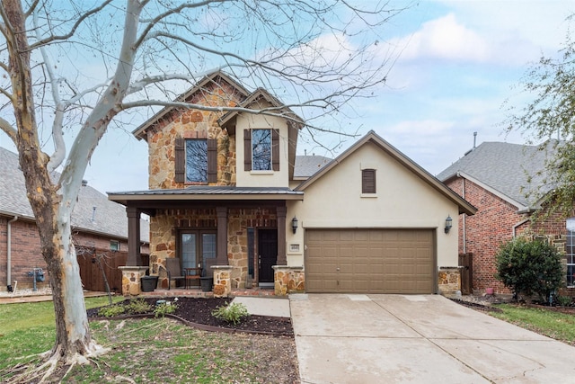 view of front facade with a garage and french doors