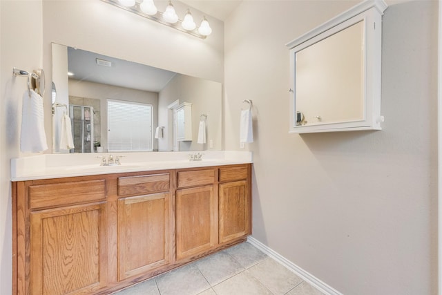 bathroom with vanity, tile patterned floors, and walk in shower