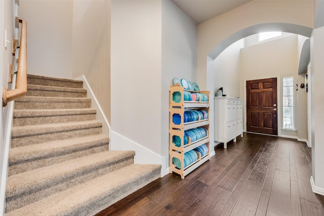 entryway with dark hardwood / wood-style floors