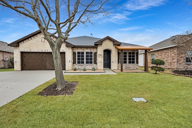 view of front facade with a garage and a front lawn