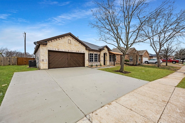 single story home featuring a garage, cooling unit, and a front lawn