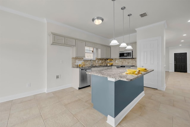 kitchen with crown molding, gray cabinets, appliances with stainless steel finishes, a center island, and decorative light fixtures